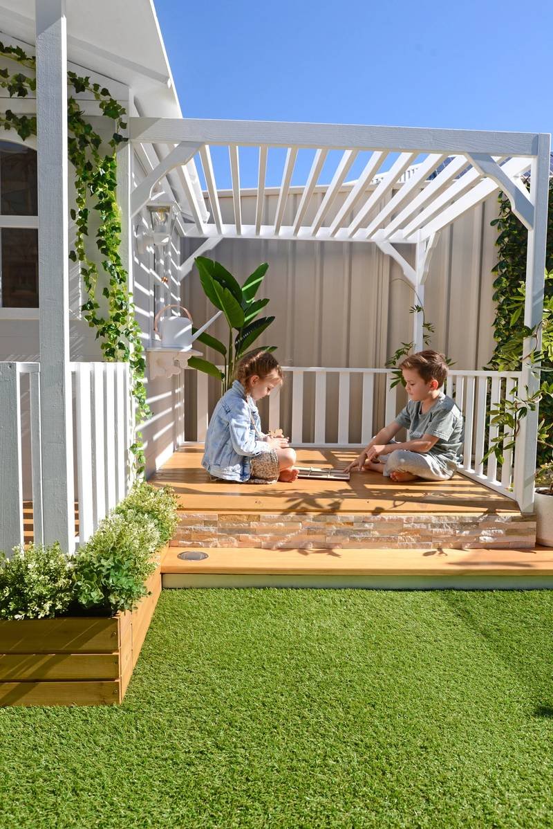 Kids enjoying outdoor pergola space